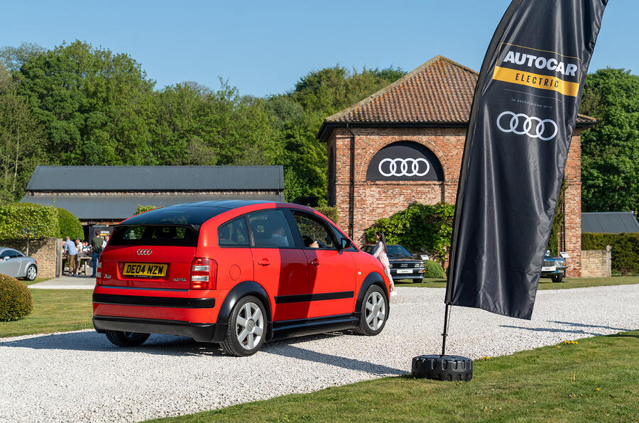 A silver alloy wheel with multiple spokes attached to a car, highlighting the vehicle's sleek design and functionality.