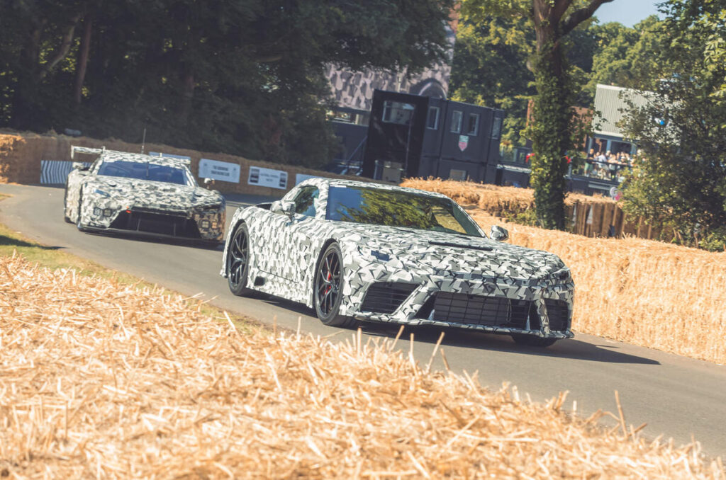A sleek modern car parked on a city street, showcasing its shiny exterior and stylish design.