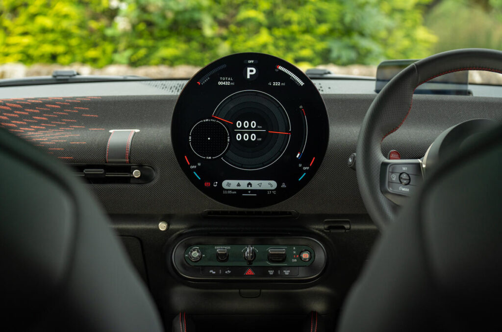 A modern car parked on a city street, showcasing sleek design and advanced technology.