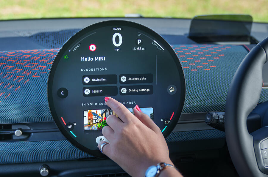 A modern electric car parked on a city street.