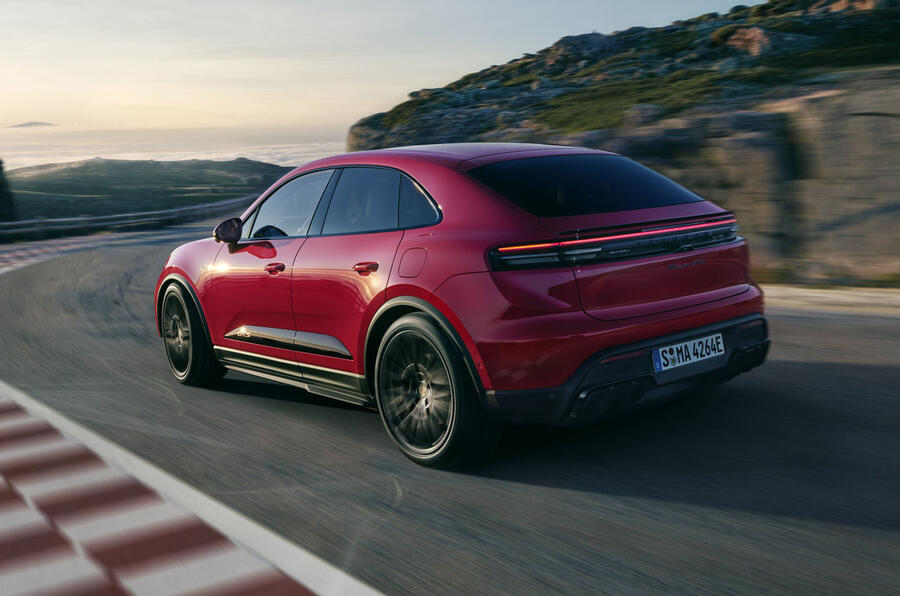 A sleek hatchback car parked on the street, showcasing its modern design and shiny wheels.